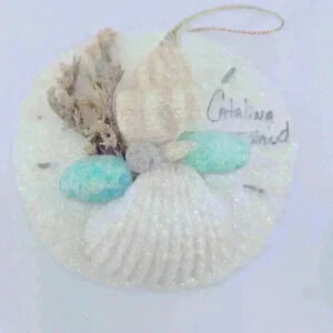 From Catalina Island sea shell Christmas ornament with teal color and glitter
